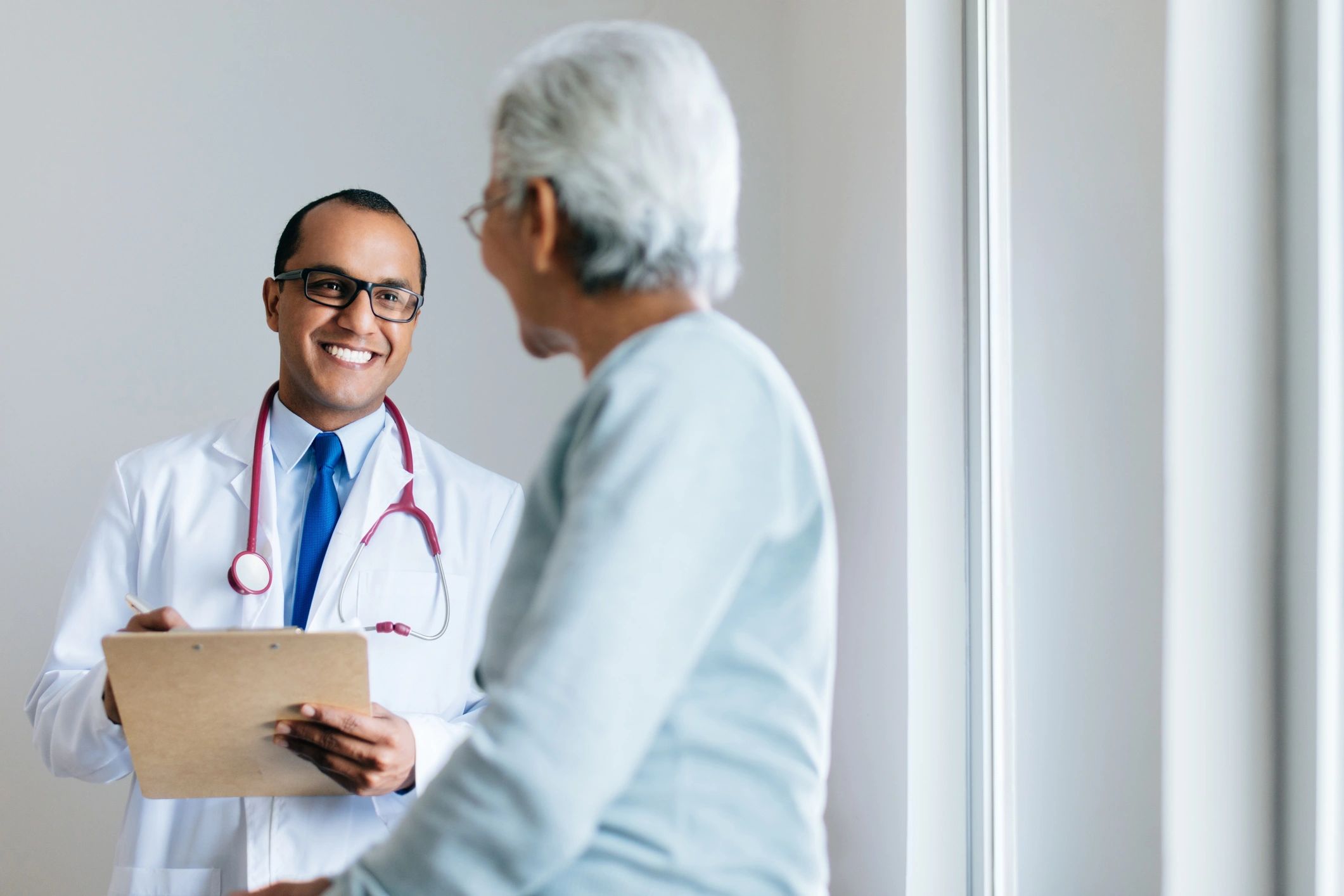 Doctor consulting with a patient during a routine visit