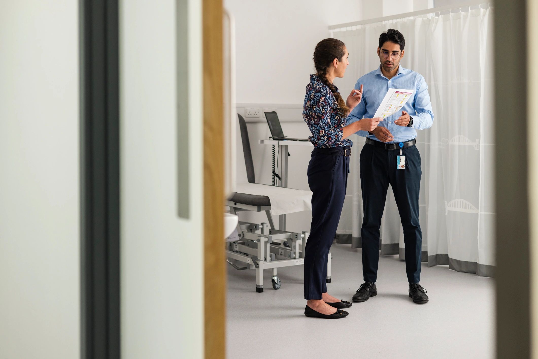 Doctors discussing patient care in a professional clinic setting